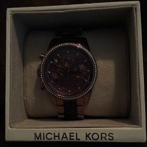 Metallic purple Never worn purple band and face face is surrounded by CZ’s